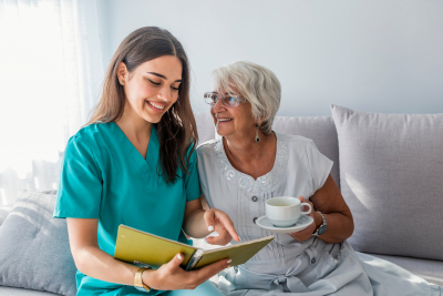 patient is holding caregiver for a hand while spending time together